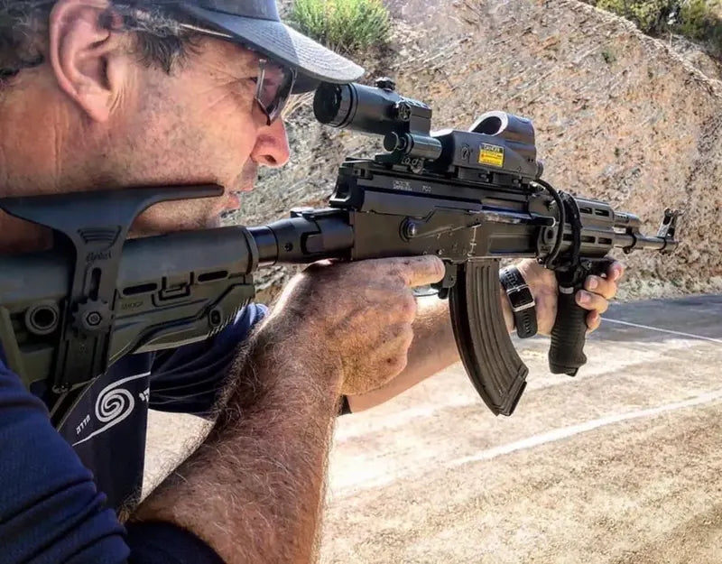 Shooter aiming an AK with FAB Defense upgrades