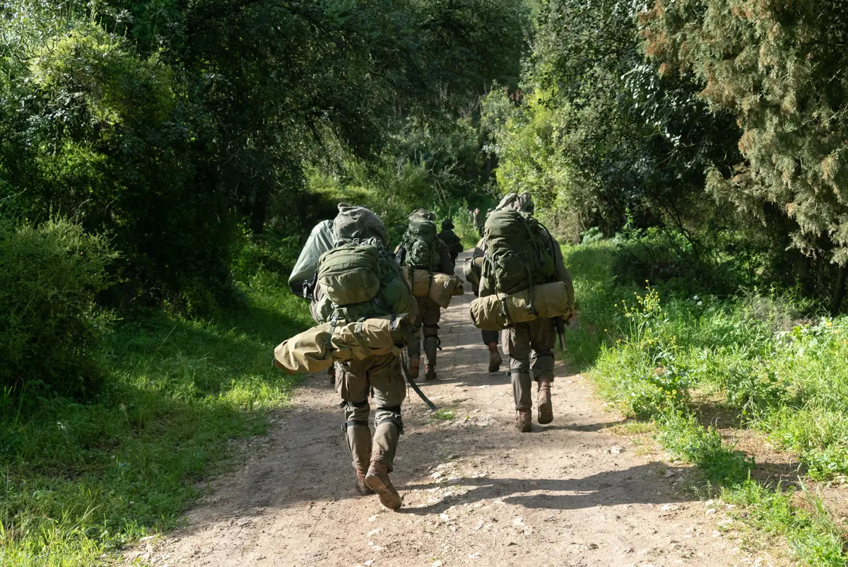 Patrol moving along a forest trail