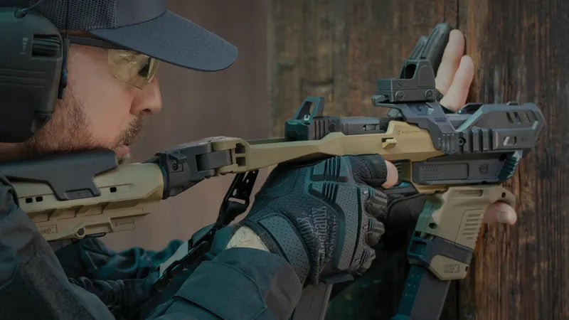 Shooter aiming a Glock in a Recover Tactical 20/20X stabilizer